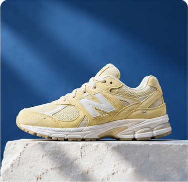 A pale yellow sneaker on a blue background